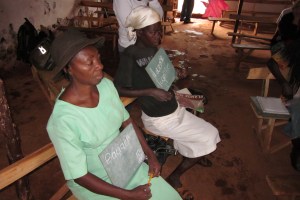 Women learning to write their names in Duchity, Haiti