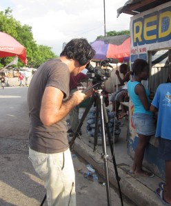 Ross Velton filming in a tented camp in Port-au-Prince